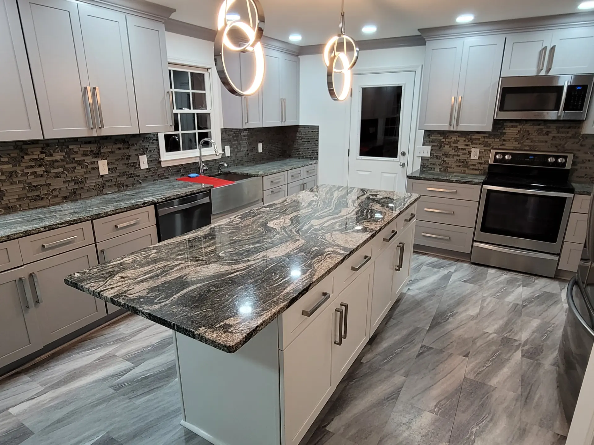 Milton exotic granite kitchen island overhang pendant lighting farm sink